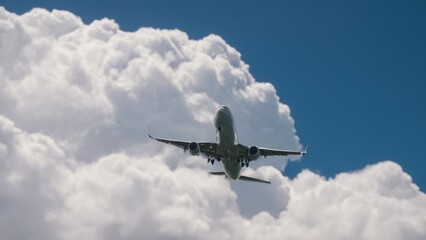 Obraz premium plane flying through a blue sky with lots of clouds in the middle of it