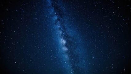 a photograph of the milky in the night sky with stars and a bright light shining from the center