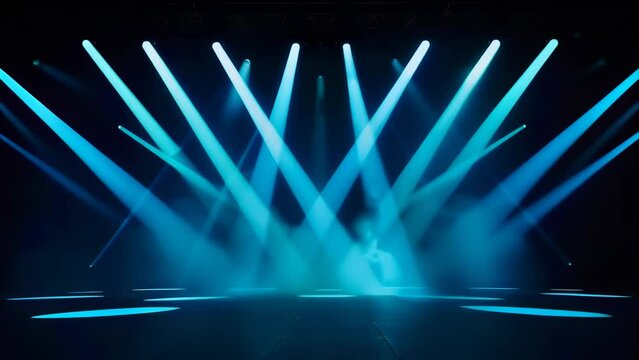 Dramatic stage illuminated by intense blue spotlights. Five main beams create a focal point on reflective floor. Hazy atmosphere adds depth. Dark background enhances contrast. 