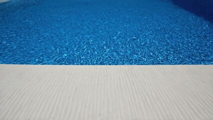 a photograph of the bottom of a swimming pool next to the bottom of a white and blue pool