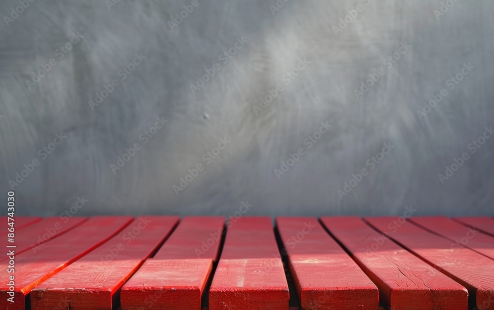 Poster vibrant red wooden table with blurred corporate gray background in bright diffused sunlight, emphasi