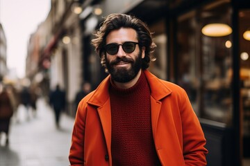 Fototapeta premium Handsome bearded man in sunglasses is walking in the city.