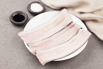   A freshwater fish of the eel family. The body is about 60cm long, thin, yellow or black, and the...