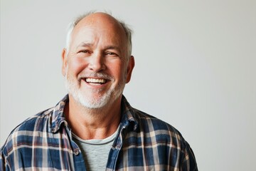 Obraz premium Portrait of a smiling senior man. Isolated on white background.
