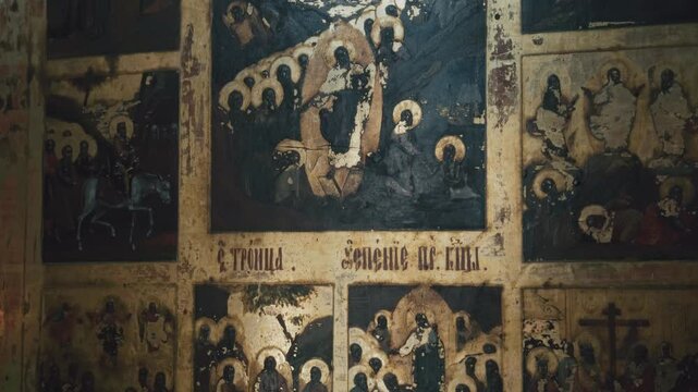 An ancient holy icon depicting the faces of saints. The Holy Trinity. Religion, Orthodoxy, Christianity. The Church of the Ascension of the Lord. Kasli, Russia.