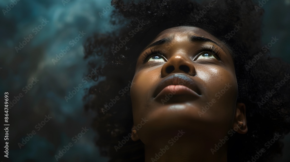 Wall mural Touched by His Grace. Beautiful young black woman looking up with tears in her eyes. Christian concept - Wall murals