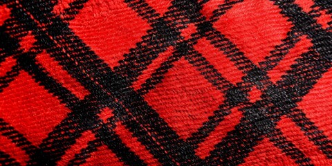 Knitted plaid background. Fabric texture plaid