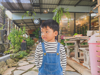 Portrait of a smiling boy, embodying joy and childhood happiness indoors