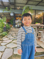 Portrait of a smiling boy, embodying joy and childhood happiness indoors