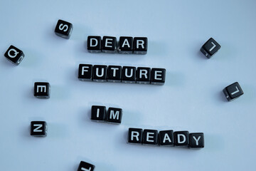 Concept of Dear Future Im Ready written on wooden blocks. Cross processed image on Wooden Background