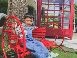 Children playing happily on a colorful playground in a sunny park filled with slides, swings, and other fun equipment under a bright blue sky