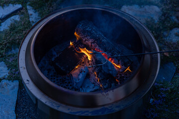 Melted Marshmallow on stick in fire pit at night - wide 