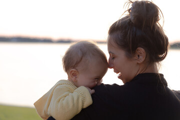 Mother and young daughter smiling - close up on faces 