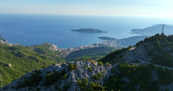 Aerial view overlooking the mountainous coastline of Budva, Montenegro, sunny day