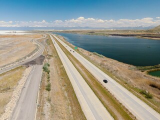 Interstate 80 freeway on the shoreline of The Great Salt Lake, Salt Lake City, Utah, United States of America. 