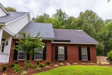 New roof and old roof on house, showing comparison of the two.