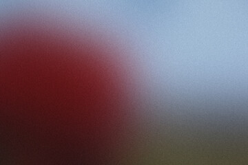Abstract grainy gradient background fading from red to blue