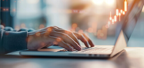 Hands typing on a laptop keyboard with financial charts overlay, representing business analysis and stock market trends.