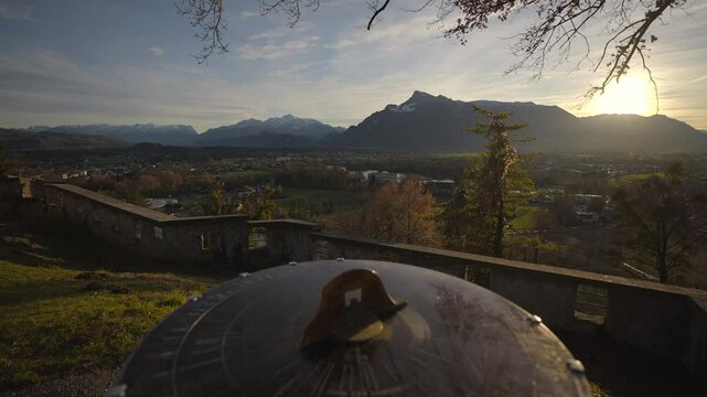 Mountain view from monchsberg hill from pointer or compass at sunset in sunny winter weather, Salzburg, Austria. Josefsturm. Bertoldsturm, Stadttor. Bertolds Zwinger. Mittelalter. Directional signpost