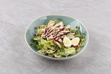 Salad with chicken and teriyaki sauce for the restaurant menu