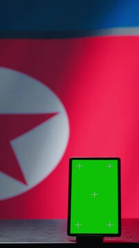 Vertical video North Korean engineer makes troll accounts with mockup tablet on social media promoting communist ideology. Admin works for Pyongyang regime building algorithms to spread government