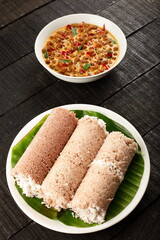 Top view- Puttu and kadala ,curry, chickpeas masala- breakfast dish from Kerala. 