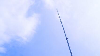 high pole with blue sky background copy space