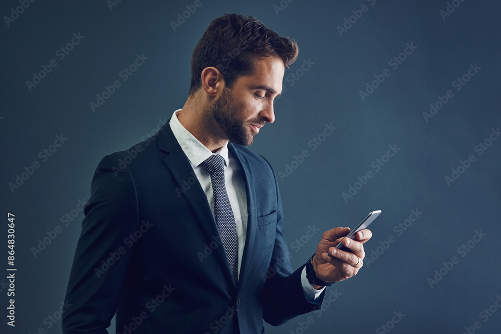 Canvas Prints Businessman, reading and internet with smartphone on studio background for corporate communication, digital connection and happy. Manager, emails and online for business app, networking and website.