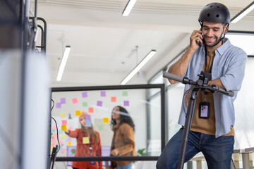 Startup Member Arrives by Scooter