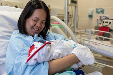 A happy mother trying Breastfeeding New Born baby boy, New family and baby healthy concept