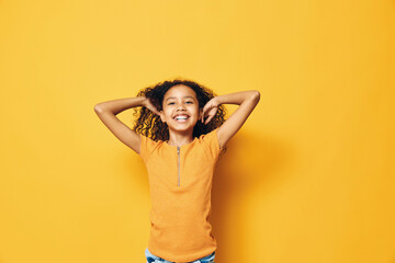 Fototapeta premium Woman fashion background young beauty children girl female yellow girl childhood little person portrait cute