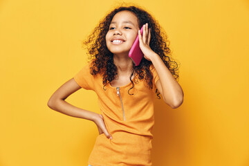 Fototapeta premium Woman girl yellow female childhood person happy background background cute portrait young girl beauty