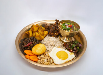 Newari Khaja Set Typical Nepali Thali with Rice Flakes, Choyila, Eggs, Chickpeas, Aalu Sadheko Lunch