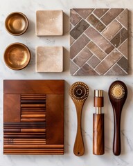 A flat lay of wooden utensils, textured tiles, and small bowls arranged neatly on a marble surface.