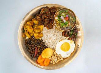 Newari Khaja Set Typical Nepali Thali with Rice Flakes, Choyila, Eggs, Chickpeas, Aalu Sadheko Lunch