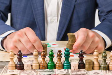 a person playing chess with coins