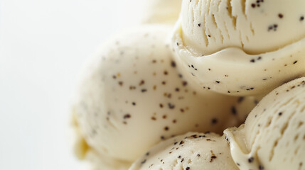 Fototapeta premium A closeup image of decadent bourbon vanilla bean ice cream, its creamy texture and speckled appearance highlighted against a pure white background