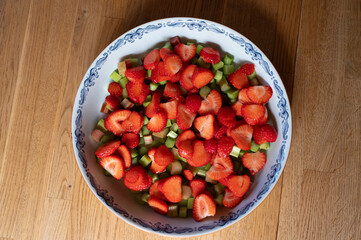 Pie form with bits of strawberries and rhubarb