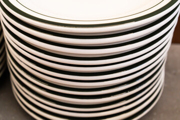 stack of the ceramic dishes in the cafeteria