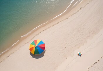 Obraz premium View from above of a colorful beach umbrella on a empty clean white sand beach, postcard sample, free space, background