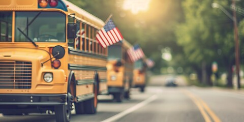 School buses adorned with American flags line a sunny street surrounded by greenery, capturing the essence of a vibrant community.