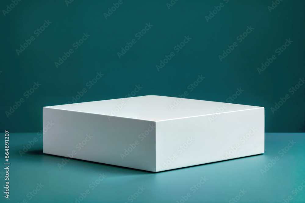 Poster Minimalist white square block positioned on a teal surface with a teal backdrop, illuminated by soft lighting.
