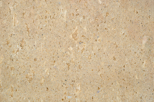 smooth surface of beige fireclay stone slab