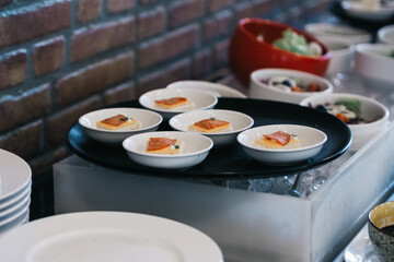 mini bread, cheese and bacon on a plate