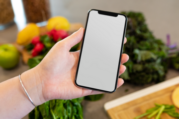 Mobile phone mockup png, transparent screen, in kitchen