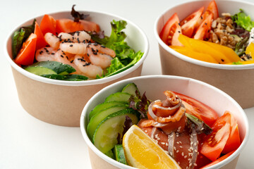 Tasty take out poke bowls isolated on white background