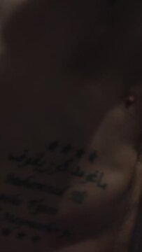 Muscular man boxing on black background. Young male boxer practicing shadow boxing