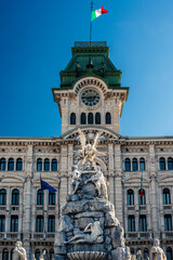 Obraz premium Historic city of Trieste. Between ancient buildings and reflections on the sea. Autumn day and celebration of the Barcolana International Regatta.