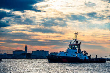 Fototapeta premium Historic city of Trieste. Between ancient buildings and reflections on the sea. Autumn day and celebration of the Barcolana International Regatta.