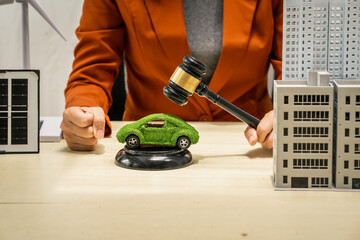 A businesswoman  lawyer working at desks in sustainable urban development, promoting eco-friendly futures with green condos and buildings, fostering a clean environment-friendly future.